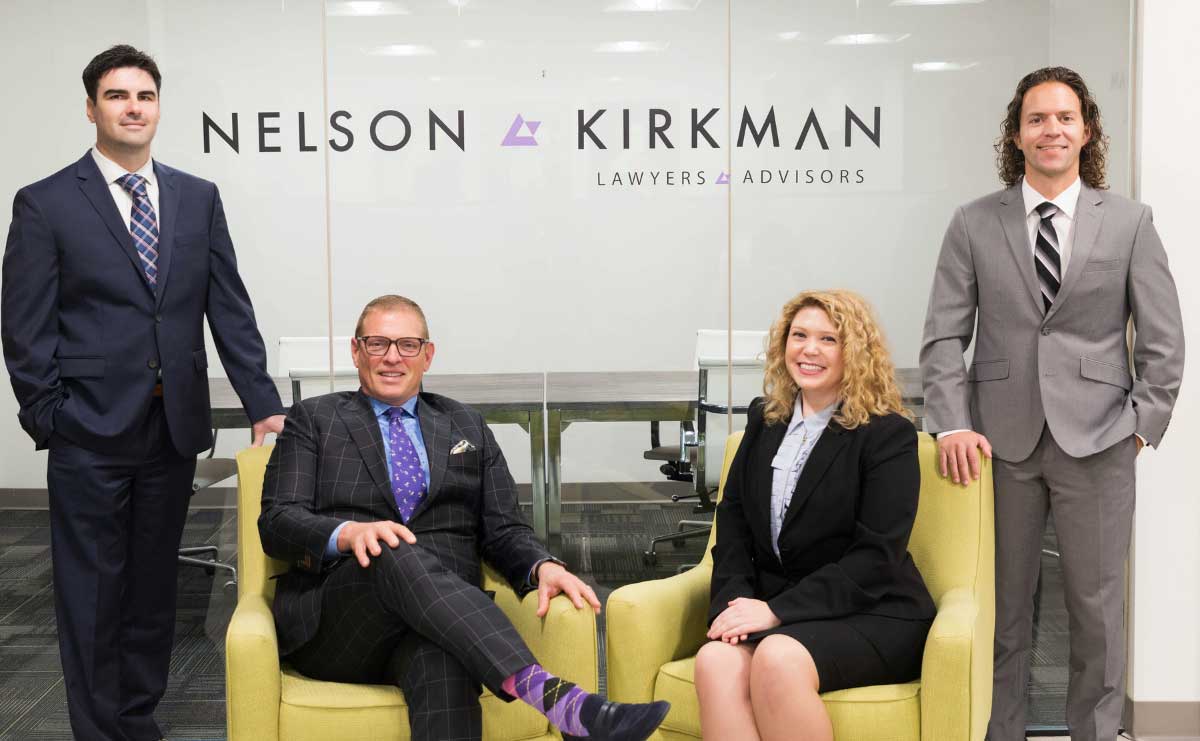 The Nelson | Kirkman legal team in the firm's lobby.